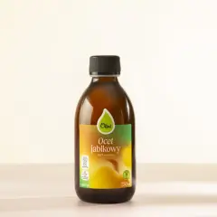 Butelka naturalnego octu jabłkowego Olini, który może być pomocny jako mikstura na zapalenie stawów.